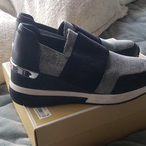 Michael Kors Felix Trainers. Silver sparkle material and silver metal on heels
